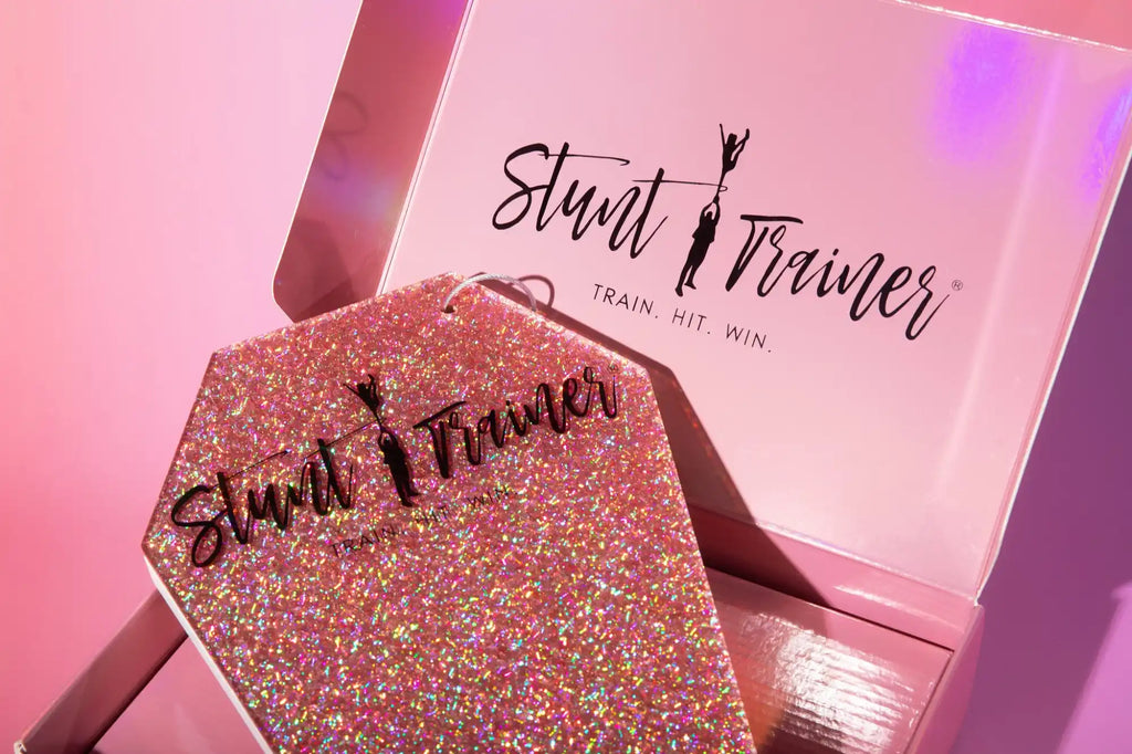 Pink glittery hexagonal tag in an open box.